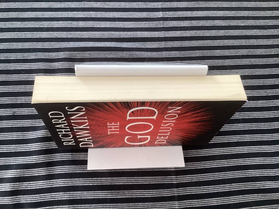 The GOD Delusion, by Richard Dawkins, Large format Paperback in a Fine Condition.