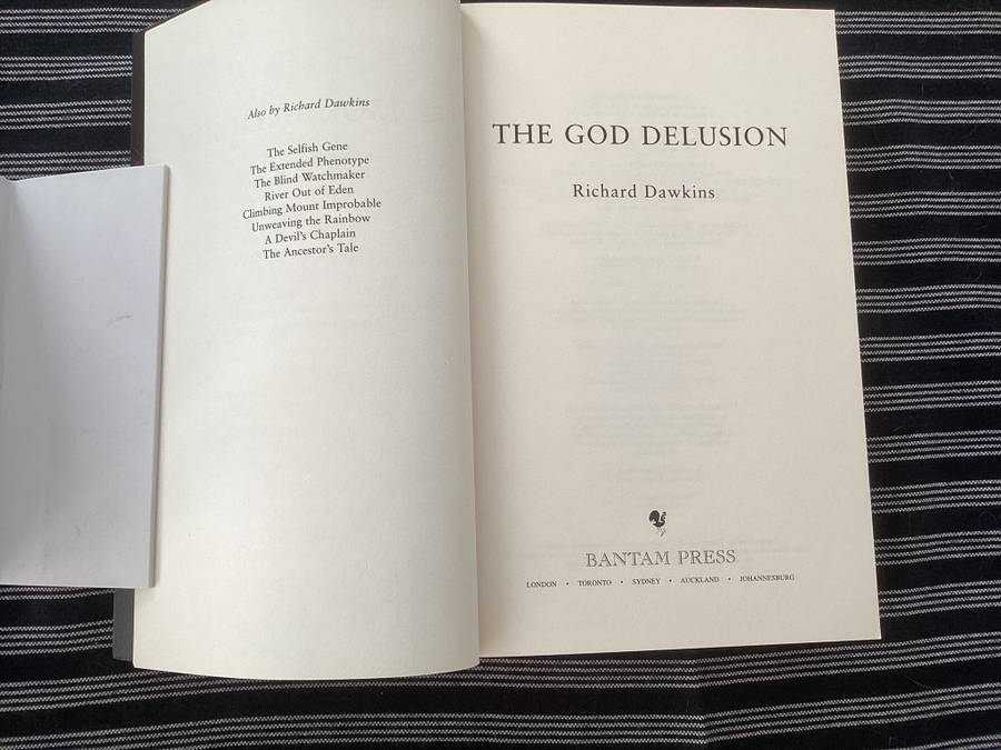 The GOD Delusion, by Richard Dawkins, Large format Paperback in a Fine Condition.