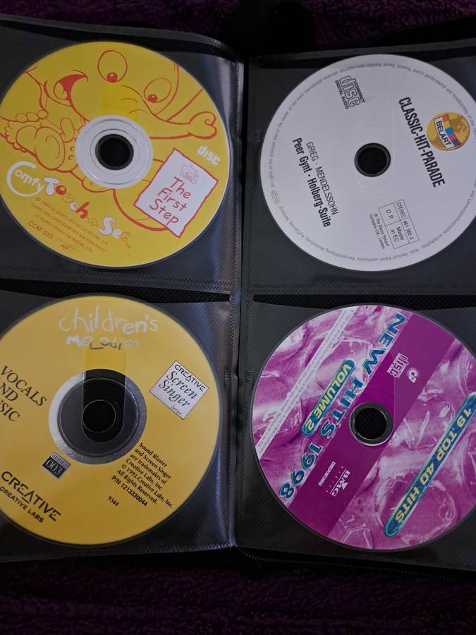 Music CDS. WITH POUCH ABOUT 60CDS MUSIC MUSIC