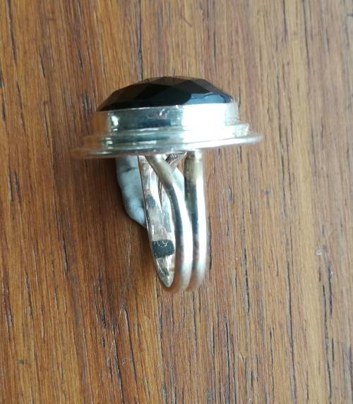 Beautiful sterling silver ladies ring with black stone.