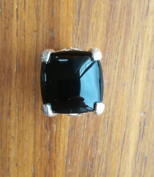 Beautiful sterling silver ladies ring with black stone.