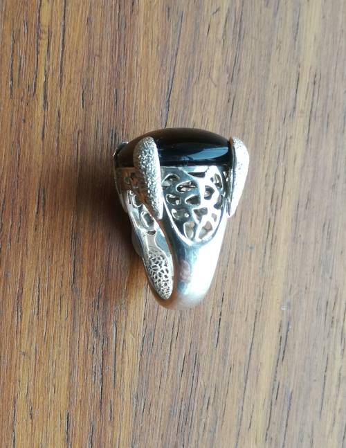 Beautiful sterling silver ladies ring with black stone.