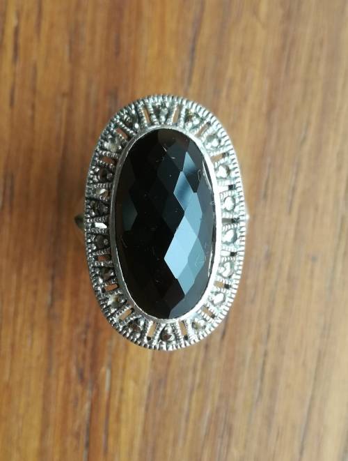 Beautiful sterling silver ladies ring with black stone.