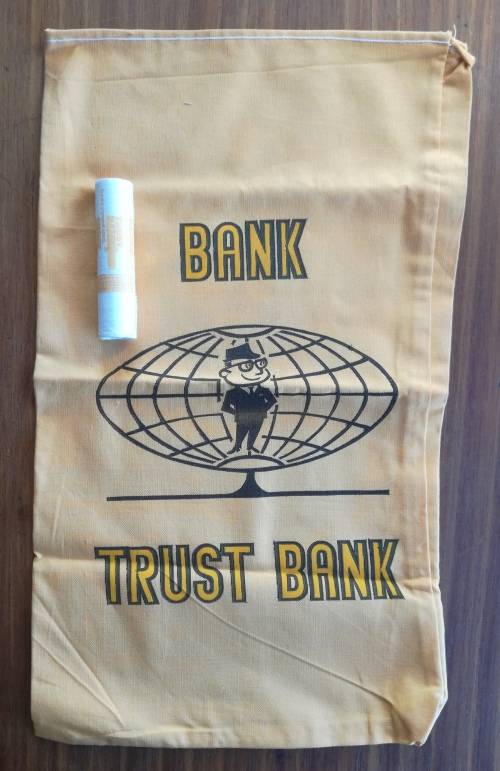 Trust Bank 1989 Full unopened roll one cents and trust Bank material bank bag.