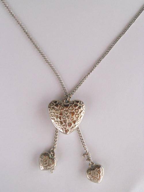 Silver costume jewellery long necklace with heart pendant combination