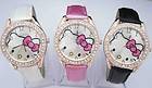 Hello Kitty watches with cat face with pink bow on gold coloured watch face