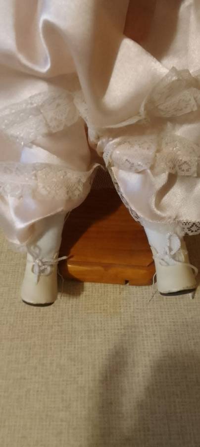 PORCELAIN DOLL - Little Miss  Pretty- 40 cm long -ON WOODEN STAND