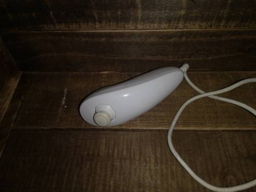 NINTENDO WII WITH 2 CONTROLLERS AND 2 NUNCHUCKS AND TOP SHOT ELITE