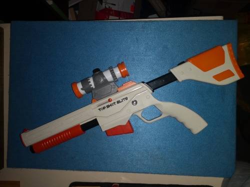 NINTENDO WII WITH 2 CONTROLLERS AND 2 NUNCHUCKS AND TOP SHOT ELITE