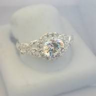 Sterling silver ring with clear cubic zirconia stones with vine effects on sides
