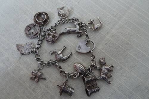 Stunning Silver Bracelet with 13 Lucky Charms (Please see Description) in Good Condition