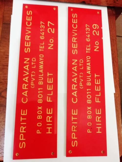 TWO RHODESIA SIGNS.