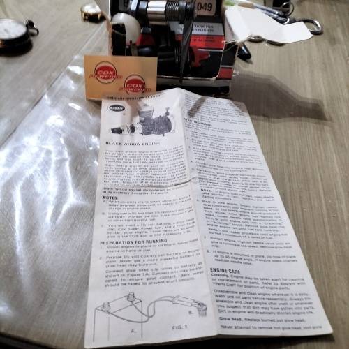 COX .049 MODEL AIRCRAFT ENGINE, BLACK WIDOW. AND ONE OTHER ENGINE.