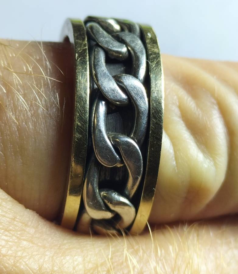 MEN`S SILVER AND 9ct GOLD RING.