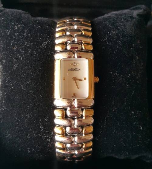 Michelle Herbelin two tone ladies watch   Retail  15500.00