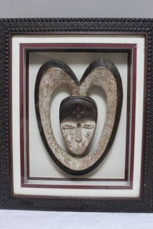 Box framed 3D African head carved from stone