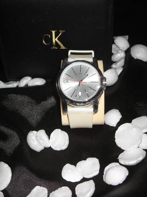 CK~Calvin Klein Women's Quartz silver dial with date display.