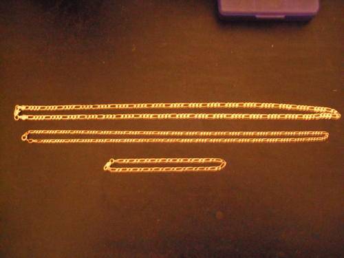 Two gold chains and a bracelet