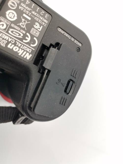 NIKON D200 CAMERA WORKING COMPLETE WITH CHARGER AND LENSE PLEASE NOTE THE BATTERY COVER IS LOSE!!!