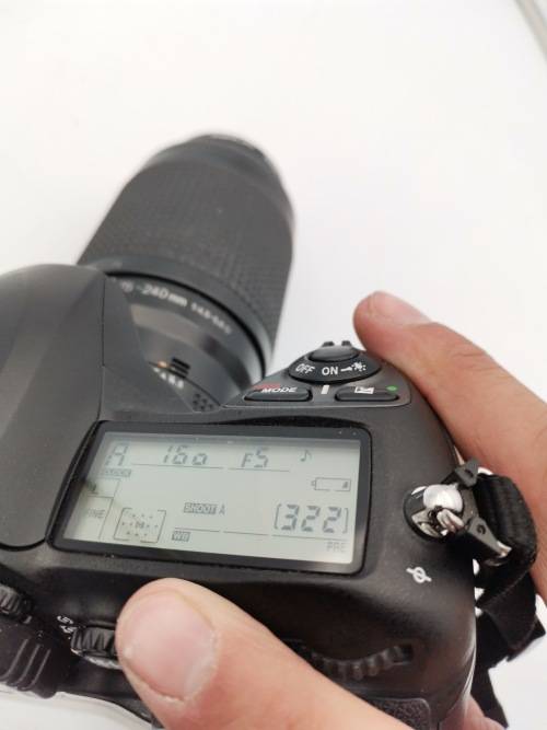 NIKON D200 CAMERA WORKING COMPLETE WITH CHARGER AND LENSE PLEASE NOTE THE BATTERY COVER IS LOSE!!!