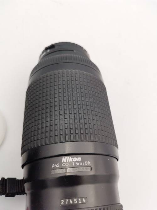 NIKON D200 CAMERA WORKING COMPLETE WITH CHARGER AND LENSE PLEASE NOTE THE BATTERY COVER IS LOSE!!!