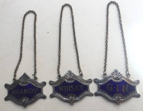 VINTAGE WHISKY, BRANDY and GIN DECANTER , ENAMELED BRASS NECK TAGS