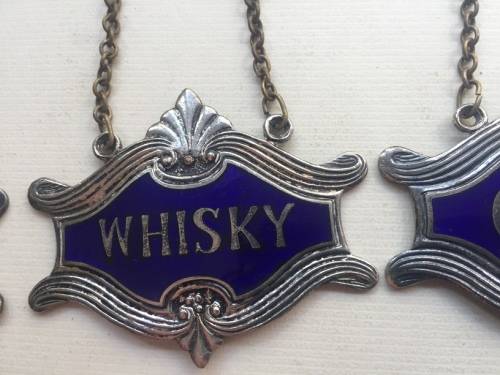 VINTAGE WHISKY, BRANDY and GIN DECANTER , ENAMELED BRASS NECK TAGS
