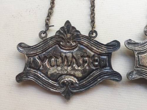 VINTAGE WHISKY, BRANDY and GIN DECANTER , ENAMELED BRASS NECK TAGS