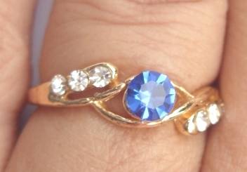 Golden Ring with Topaz and six Diamonds