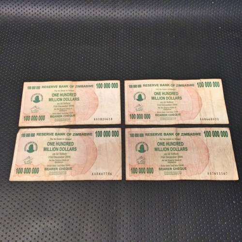 Four Zimbabwe Hundred Million Dollar Banknotes
