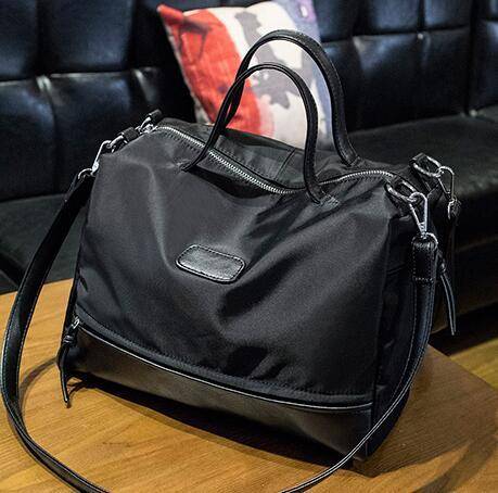 Nylon Oxford fabric strong and wild matches handbag. Black color.