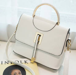 Modern stylisg handbag. White color. Stock in ZA.