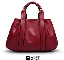Simply design large capacity ladies handbag with stretch. maroon color. Stock in ZA