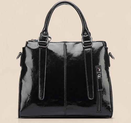 Smooth surface elegant consice ladies handbag with strape. Black color. Stock in ZA