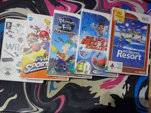 Wii + limited Mario cart racing game and x3 remotes + 6 games note Mario cart disc is in console