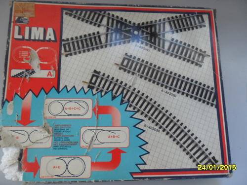 Box set of Lima railway tracks, 13 in total. Looks to never have been used, box is damaged.