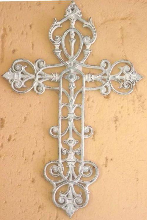 Large metal cross with detailed design
