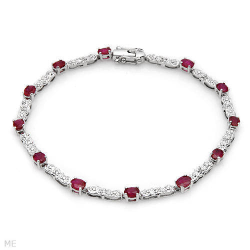 TENNIS BRACELET WITH NATURAL EYE CLEAN DIAMONDS AND RUBYS IN 10K WHITE GOLD.