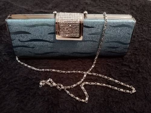 Light blue glitter clutch bag as new