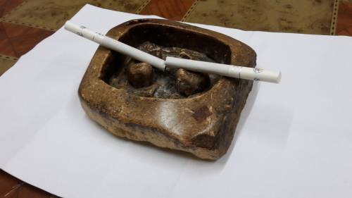 Vintage Hand Carved Rock ashtray .
