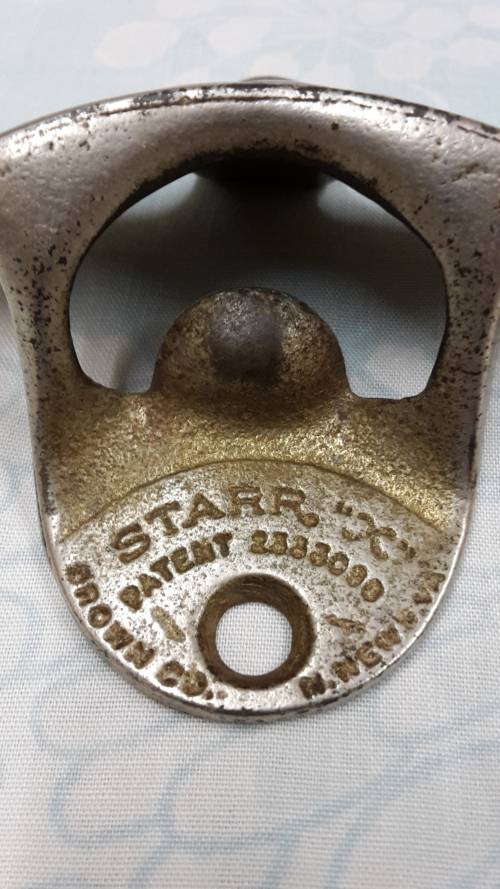 1950s Wall Mount Coke Bottle opener .