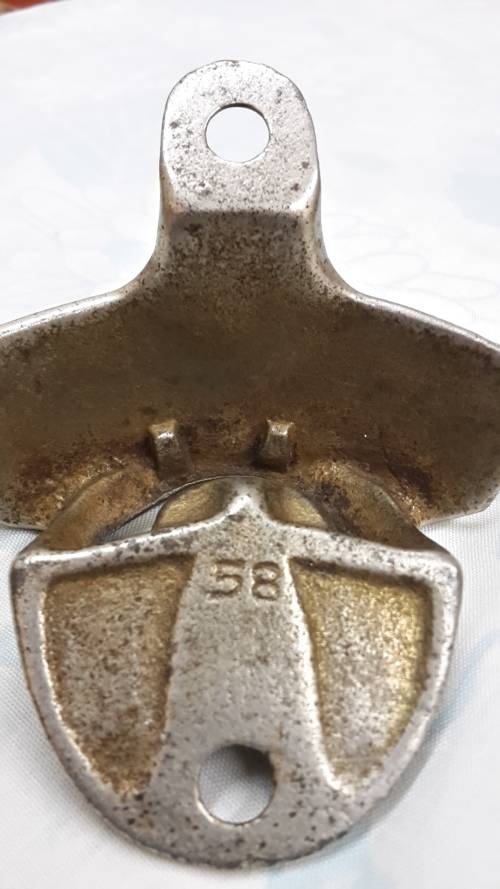 1950s Wall Mount Coke Bottle opener .