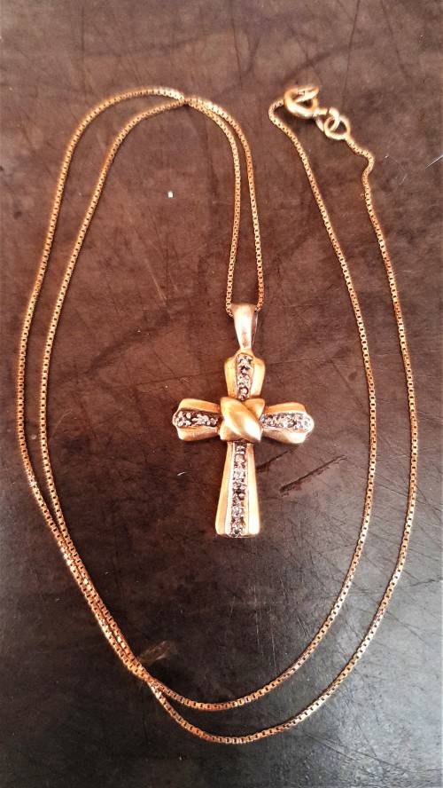 Lovely 9 Carat `Gold Cross and Chain` with small Diamond.