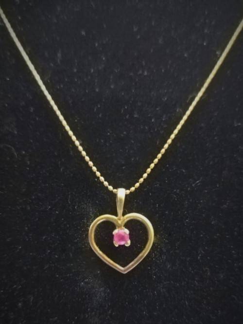 Genuine `RUBY` Heart Pendant and Chain set in 9 Carat Solid Gold.