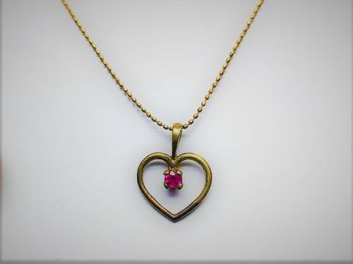 Genuine `RUBY` Heart Pendant and Chain set in 9 Carat Solid Gold.