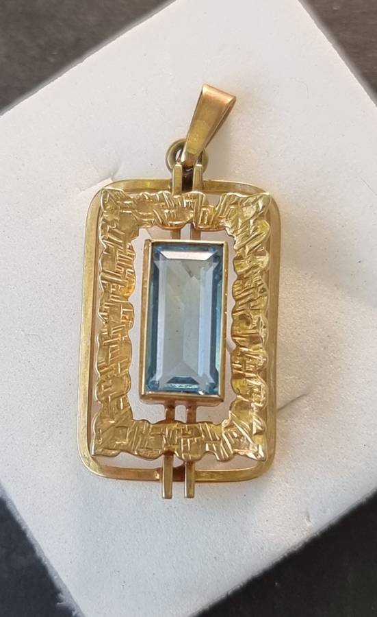 `ELECTRICK BLUE TOPAZ`  Set in a 9CT Yellow Gold Pendant (Genuine Gold)