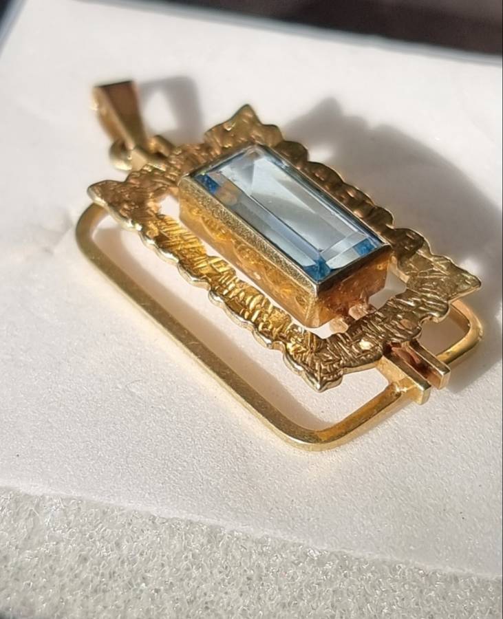 `ELECTRICK BLUE TOPAZ`  Set in a 9CT Yellow Gold Pendant (Genuine Gold)