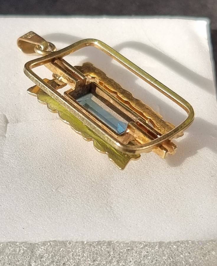 `ELECTRICK BLUE TOPAZ`  Set in a 9CT Yellow Gold Pendant (Genuine Gold)