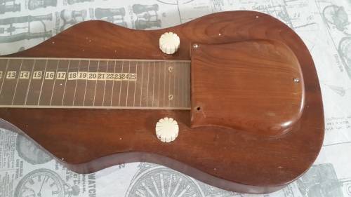 Weird vintage custom made guitar and case.