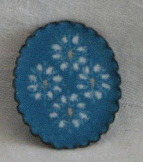 R1.00 START - Enamel Brooch - Oval in shape with a blue & white flower motiff